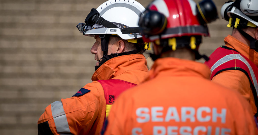 search and rescue men preparing for a genuine emergency